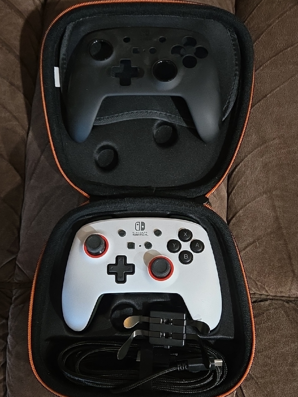 Nintendo White and Black Switch Controller with Red Stick Rings